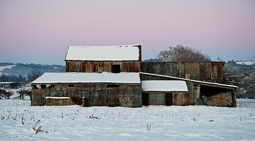 corrugated iron barn in snow